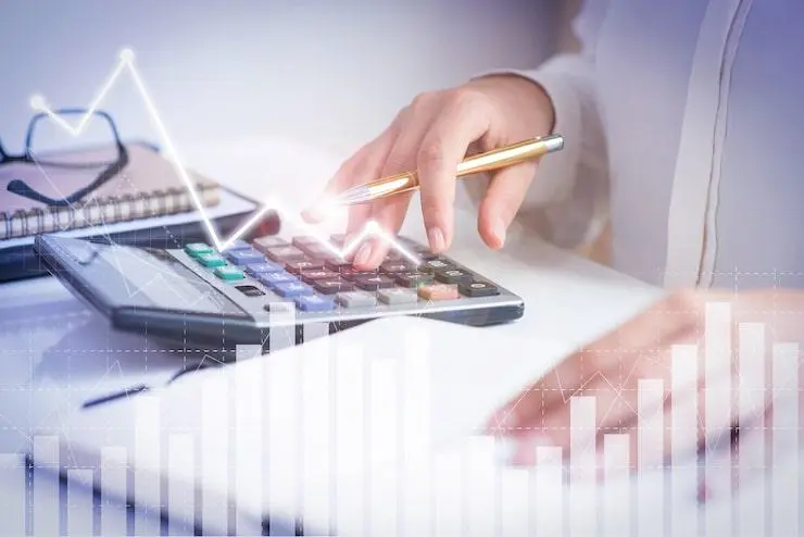 Financial documents and a calculator beneath a headline explaining industry terminology