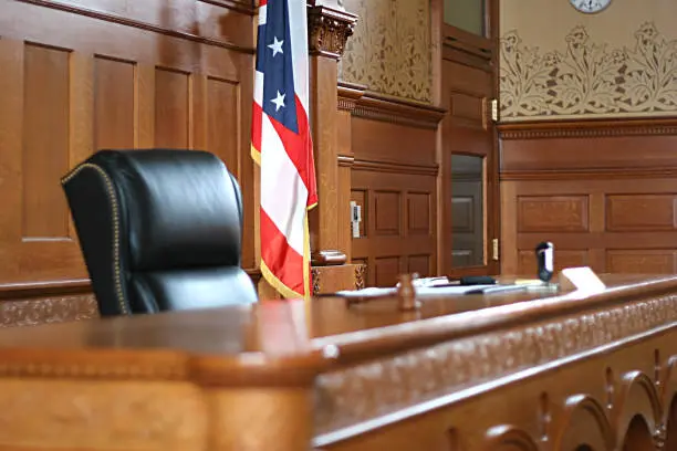 Empty judge bench in a courtroom
